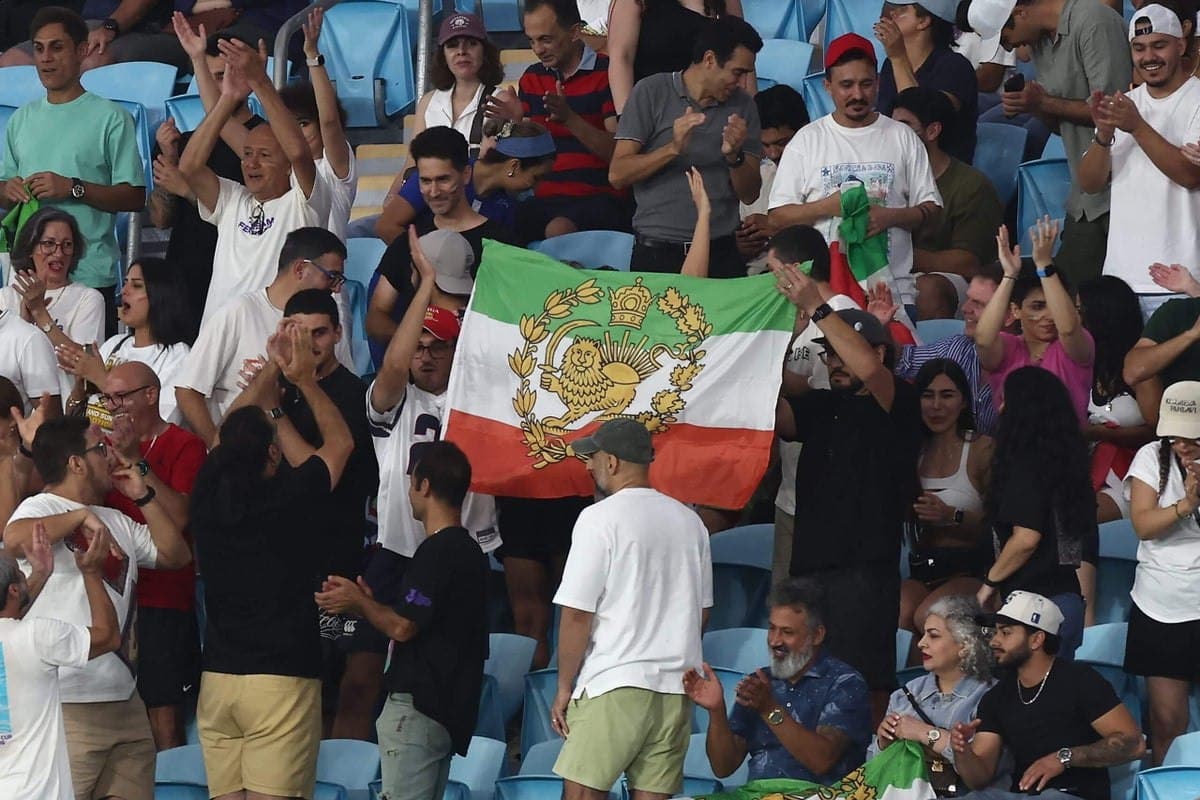 Pre-revolutionary Iran flags appear inside World Cup stadium despite FIFA ban