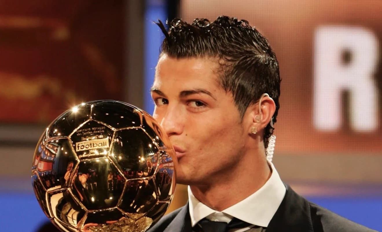 Cristiano Ronaldo reacts after beating Lionel Messi in BOAT fan vote